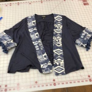 Knit cardigan with tapestry trim. S